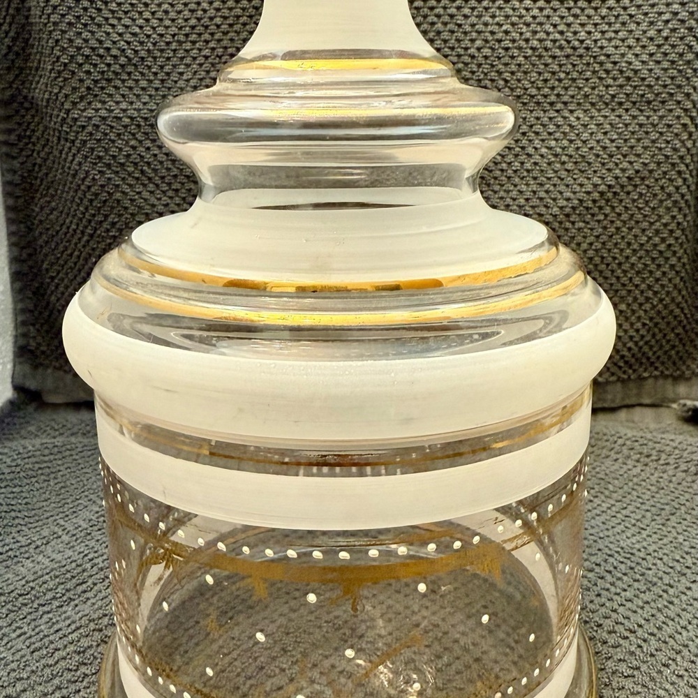 Elegant mid-century clear and frosted glass jar with gold accents.